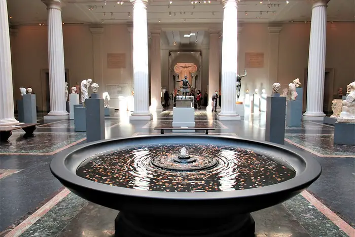 a coin fountain inside the Met